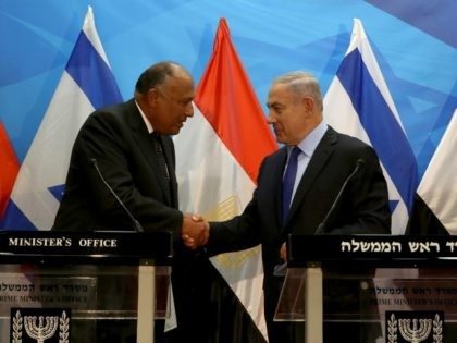 Israeli Prime Minister Benjamin Netanyahu (R) shakes hands with Egyptian Foreign Minister Sameh Shoukry after giving a joint statement prior to their meeting at his Jerusalem office on July 10, 2016. Shoukry met Netanyahu in Jerusalem for talks on reviving peace efforts with the Palestinians, in the first such visit …