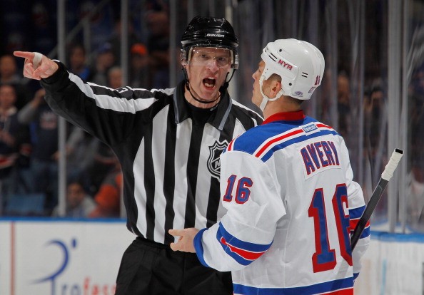 UNIONDALE, NY - NOVEMBER 15: Linesman Brian Murphy #93 penalizes Sean Avery #16 of the New