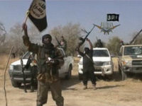 boko-haram-flag-islamic-state-africa-afp NIGERIA, UNKNOWN : A screen grab made on January 20, 2015 from a video of Nigerian Islamist extremist group Boko Haram obtained by AFP shows the leader of the Islamist extremist group Boko Haram Abubakar Shekau holding up a flag as he delivers a message. Boko Haram has claimed a …