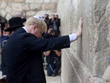 JERUSALEM, ISRAEL - NOVEMBER 11: Mayor of London, Boris Johnson prays at the Western Wall, Judaism's holiest site, on November 11, 2015 in Jerusalem's Old City, Israel. Johnson arrived in Israel on Monday in a bid to boost London's economic ties with the region. The Mayor began his visit in …