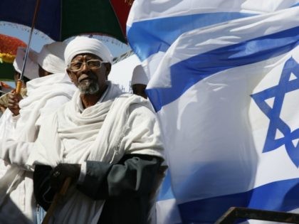 Israeli 'Kessim' or religious leaders of the Ethiopian Jewish community pray during the Sigd holiday marking the desire for 'return to Jerusalem', as they celebrate from a hilltop in Jerusalem, on November 20, 2014.