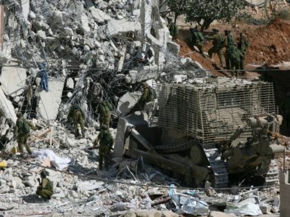 Israeli forces demolish a house during an Israeli army operation in the West Bank city of