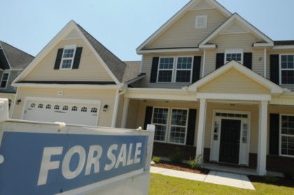FILE - This June 19, 2014, file photo, shows a home for sale in Wilmington, N.C. Real est