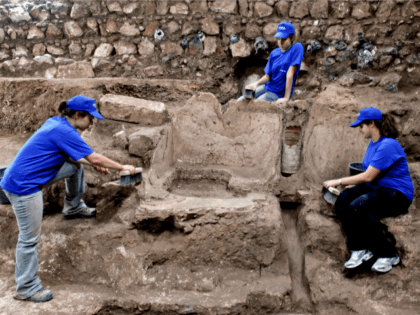 In this handout photo provided by Israel Antiquities Authority, Workers labor at archaeological excavations that uncovered a 1,800 year old bathing pool on November 22, 2010 in Jerusalem, Israel. The discovery was made in the area where a miqve or male bath is to be built. (Photo by Shlomi Amami/Israel …