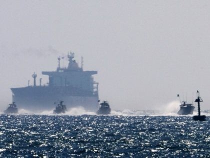 Israeli military boats approach the southern port of Ashdod on May 31, 2010, after Israeli