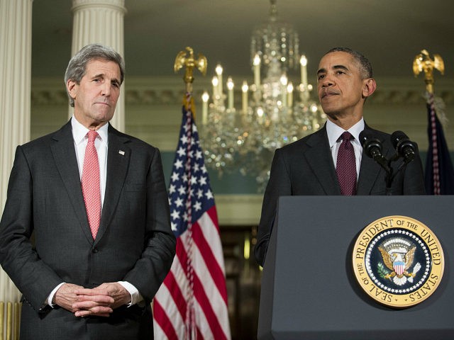 WASHINGTON, DC - FEBRUARY 25: (L-R) Secretary of State John Kerry looks on as U.S. Preside