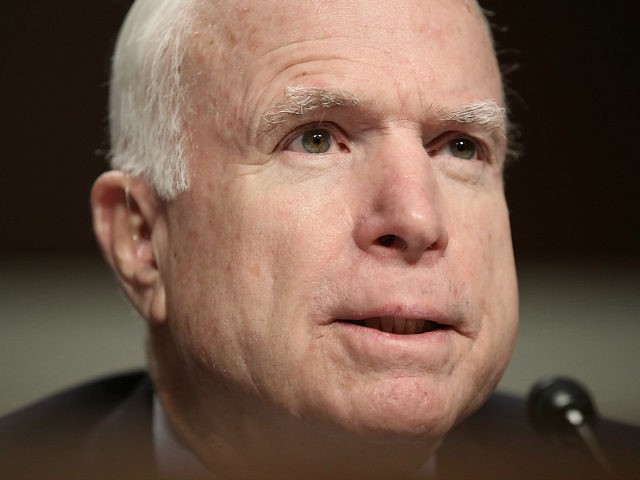 WASHINGTON, DC - MARCH 08: Sen. John McCain (R-AZ) listens as Army Gen. Joseph Votel, comm