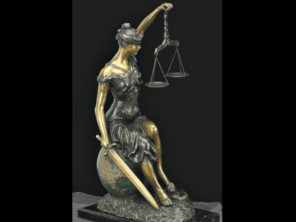 lady_justice_sitting_on_world