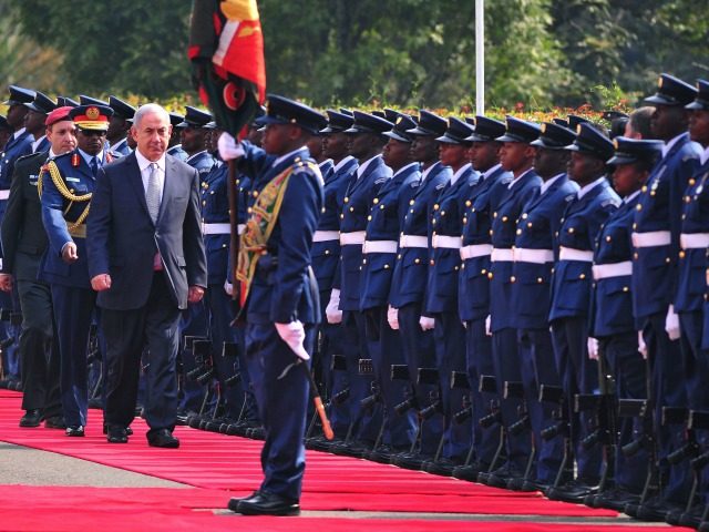 Israeli Prime Minister Benjamin Netanyahu inspects a guard of honour at the State House in