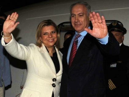 A handout picture released by the Israeli Government Press Office shows Israeli Prime Minister Benjamin Netanyahu and his wife Sara waving as they depart Israel to the United States early on May 17, 2009 at Ben Gurion Airport near Tel Aviv. Netanyahu headed to Washington for his first meeting with …