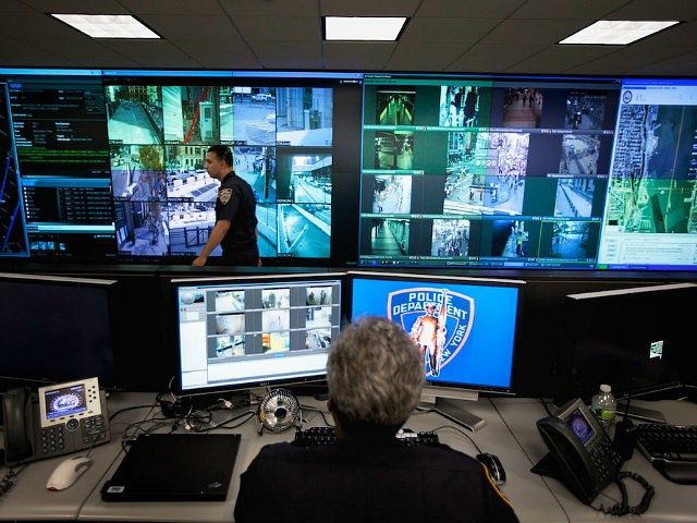 A New York Police Department officer watches video feeds in the Lower Manhattan Security I