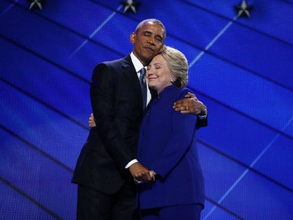 U.S. President Barack Obama hugs Hillary Clinton, 2016 Democratic presidential nominee, on