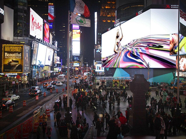 People walk underneath a giant new advertising screen in Times Square, New York, in this November 20, 2014 file photo. REUTERS/Carlo Allegri People walk underneath a giant new advertising screen in Times Square, New York, in this November 20, 2014 file photo. REUTERS/CARLO ALLEGRI