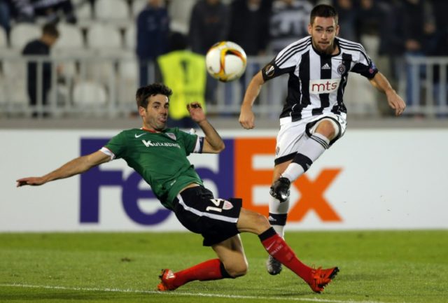 Partizan's Andrija Zivkovic (right) kicks the ball in front of Athletic's Markel Susaeta d