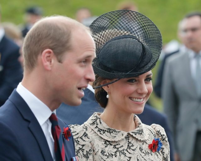 Britain's Prince William (L) speaks with French officials and his wife Britain's Catherine
