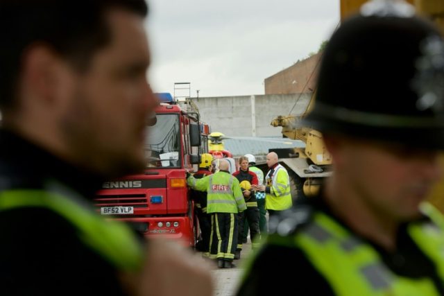 West Midlands Police work on the scene of an industrial accident at a recycling site in Ne
