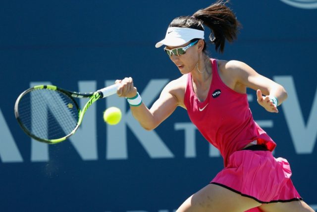 China's Zheng Sai-Sai competes against Maria Mateas of the United States during day one of