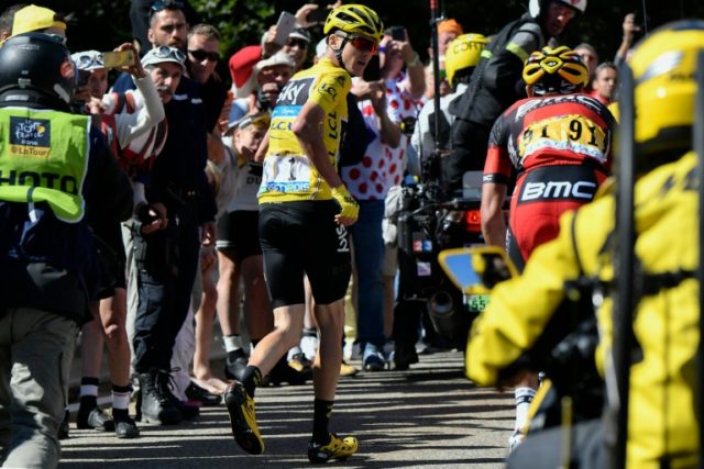 Chris Froome runs up Mont Ventoux after falling during the 12th stage of the Tour de Franc