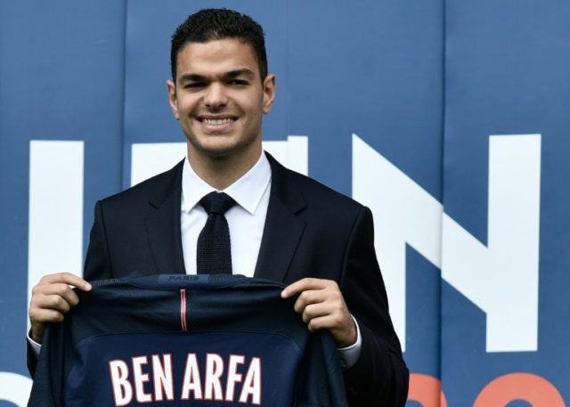 Paris Saint-Germain's new recruit French attacking midfielder Hatem Ben Arfa poses with hi