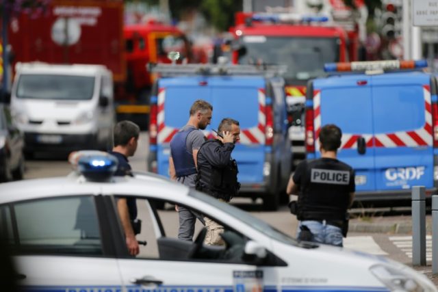 Emergency services arrive at the scene of a hostage-taking at a church in Saint-Etienne-du