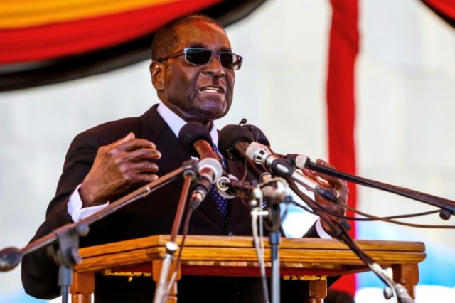 Zimbabwe President Robert Mugabe, pictured in April 2016, speaks during the burial of two