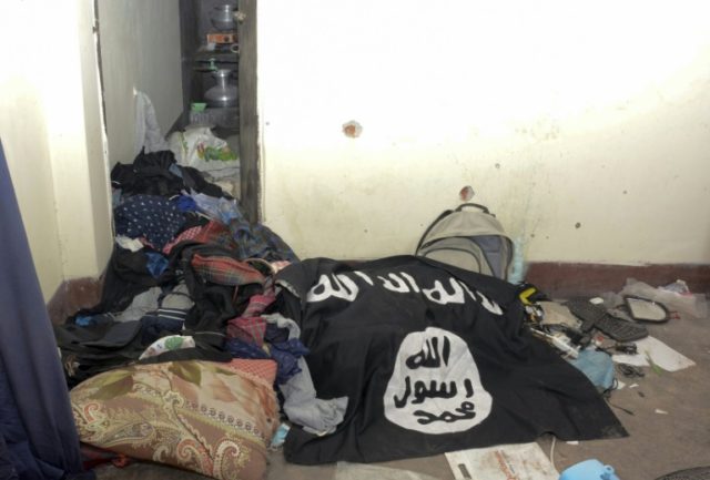 An Islamic State group flag is seen in a handout photo released by Bangladeshi police of t