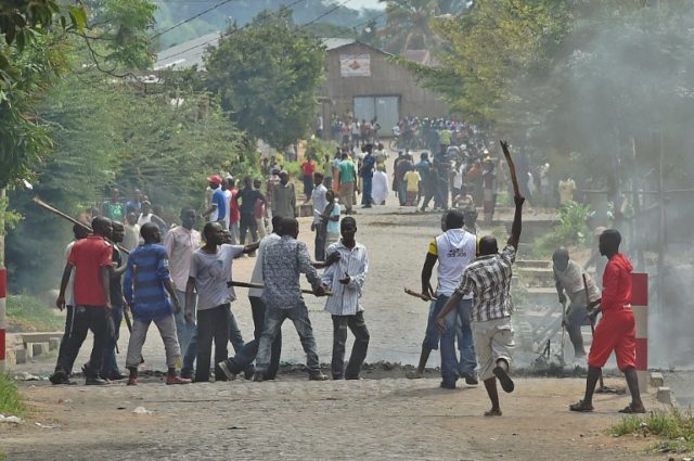 A protester opposed to the Burundi President Pierre Nkurunziza's third term is snatched by