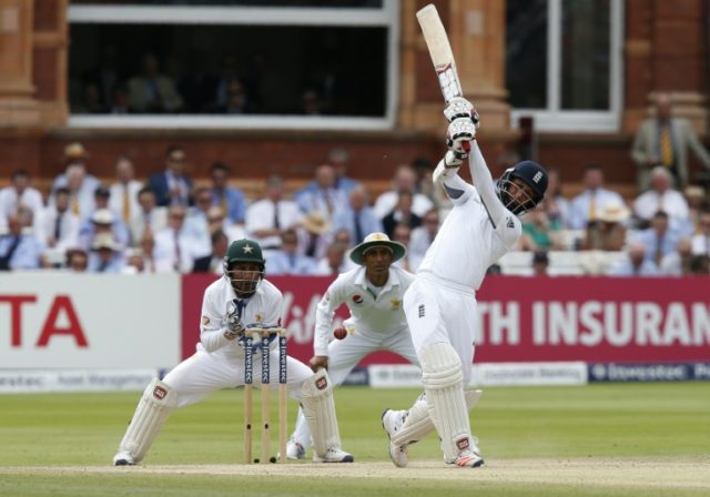 England's Moeen Ali (R) swings to play a shot but is bowled out for 2 runs by Pakistan's Y