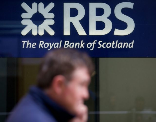Britain's Royal Bank of Scotland warned businesses they might be charged for depositing mo