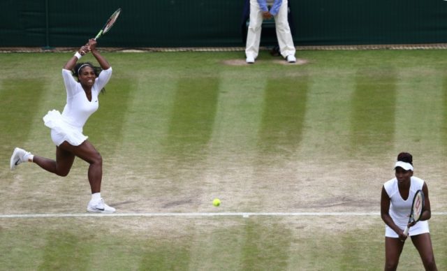 US players Serena Williams and Venus Williams return to Germany's Julia Georges and Czech