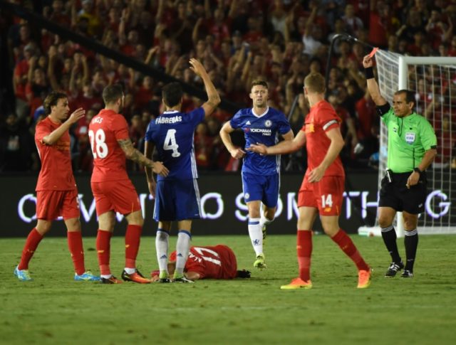 Chelsea's Cesc Fabregas (3rd L) receives a red card after fouling Liverpool's Ragnar Klava