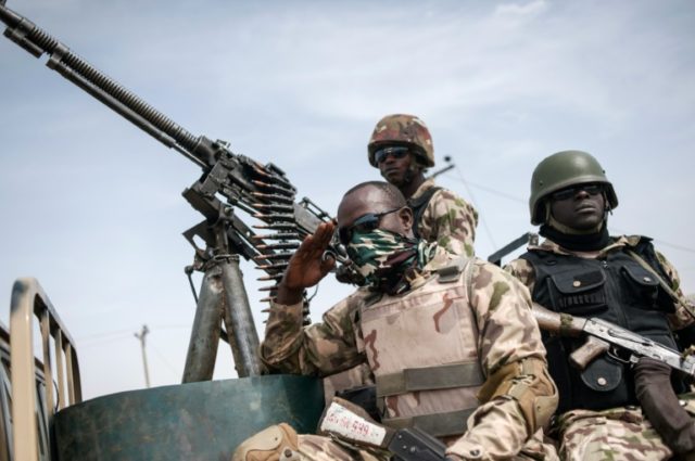 This photo taken on March 25, 2016 shows soldiers from the 7th Division of the Nigerian Ar