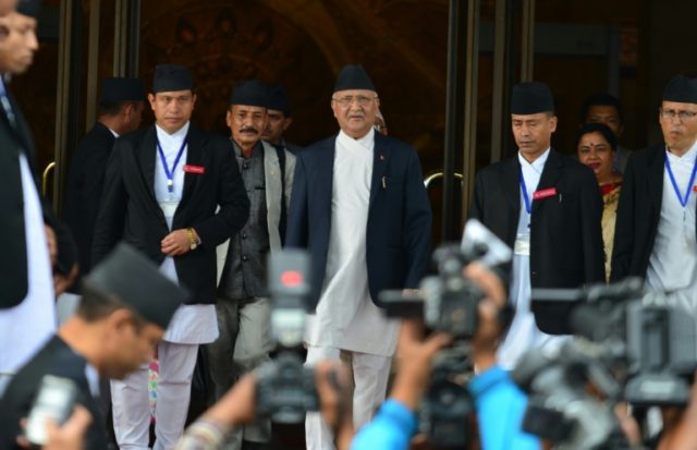 Nepalese Prime Minister K.P. Sharma Oli, (C) leaves the Parliament Building in Kathmandu,