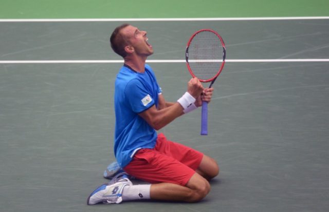 Lukas Rosol of the Czech Republic celebrates victory over Jo-Wilfried Tsonga of France dur