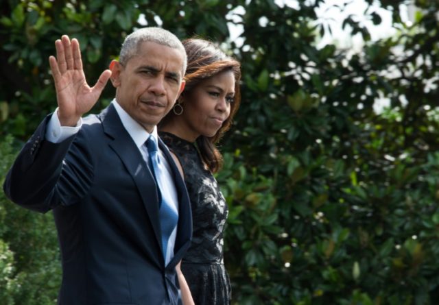 US President Barack Obama and First Lady Michelle Obama walk to board Marine One on July 1