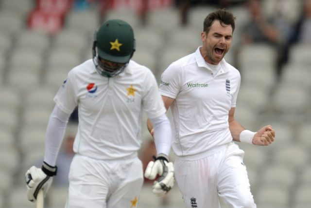 England's James Anderson (R) celebrates taking the wicket of Pakistan's Shan Masood on the