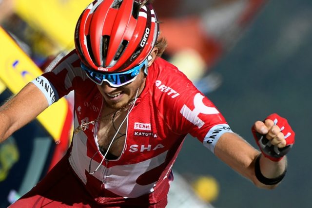 Russia's Ilnur Zakarin celebrates winning the 17th stage of the Tour de France on July 20,