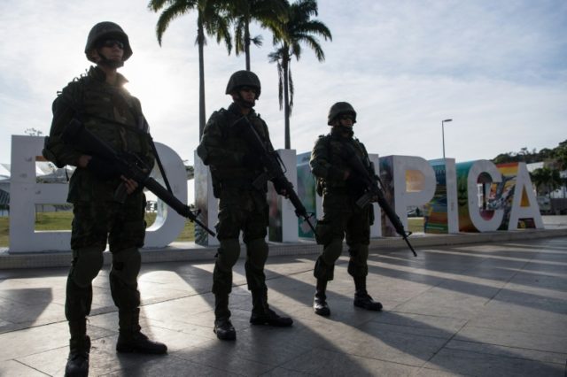 Brazilian marines stand guard at the Maua square in downtown Rio de Janeiro on July 9, 201