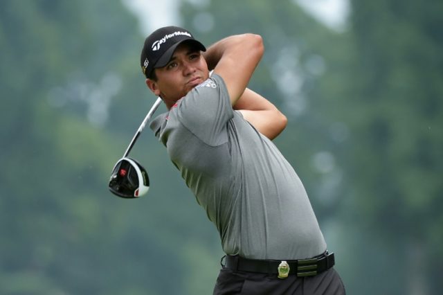 Jason Day of Australia plays his shot from the sixth tee during the continuation of the we