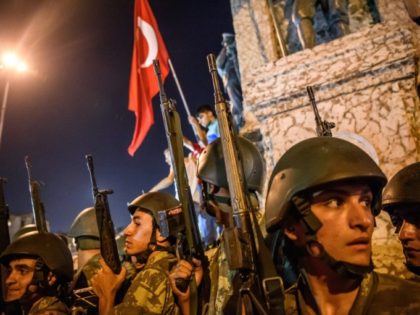 Turkish soldiers deploy in Taksim square as people protest against the military coup in Istanbul on July 16, 2016