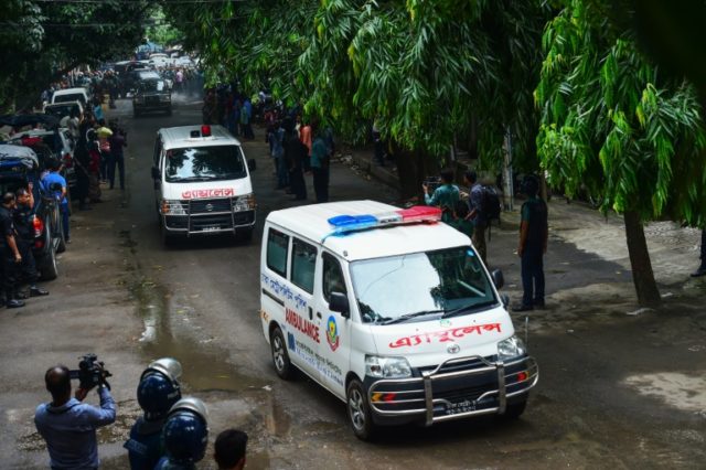Ambulances believed to be carrying the bodies of some hostages that were killed in an atta