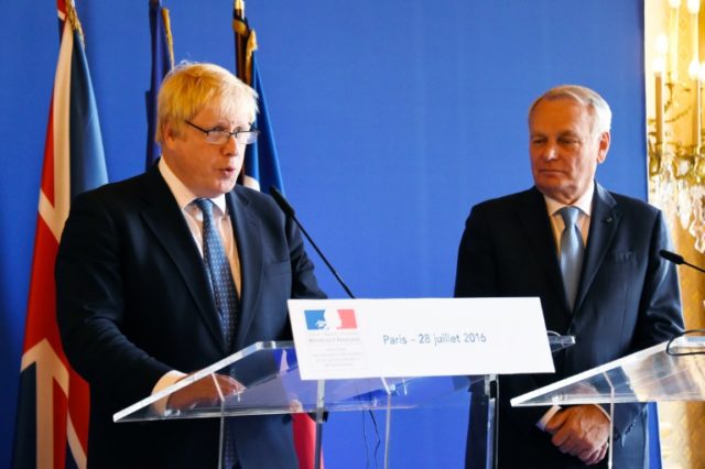 French Foreign Minister Jean Marc Ayrault (R) and Britain's Foreign Minister Boris Johnson