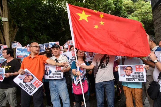 Pro-China protesters gather outside Hong Kong's US consulate to protest against the ruling