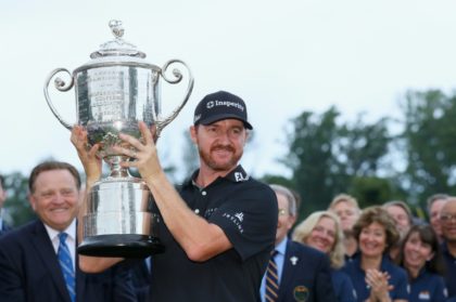 Jimmy Walker of the United States celebrates with the Wanamaker Trophy during the trophy presentation ceremony after winning the 2016 PGA Championship at Baltusrol Golf Club on July 31, 2016 in Springfield, New Jersey