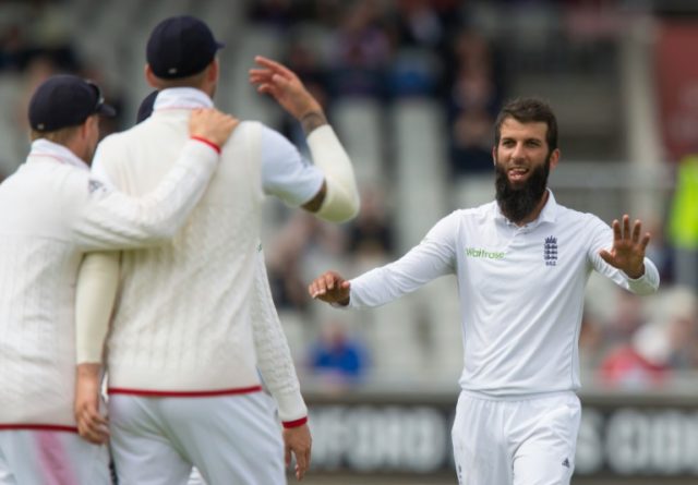 England's Moeen Ali (right) celebrates with teammates after taking the wicket of Pakistan'