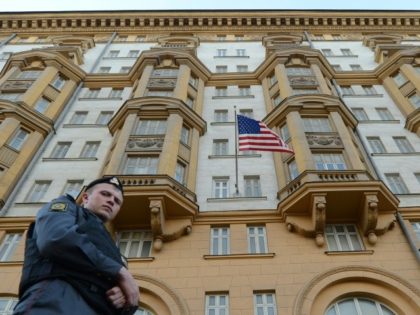 A Russian police officer stands guard outside the US Embassy in Moscow