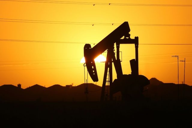 Oil prices fell on reports of rising supplies at the key transit hub of Cushing, Oklahoma,