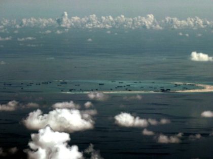 This aerial photograph taken from a military aircraft shows alleged on-going reclamation by China on Mischief Reef in the Spratly group of islands in the South China Sea in May 2015
