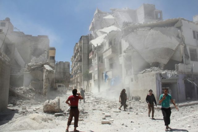 Syrian civilians walk through the debris following a reported air strike by Syrian governm