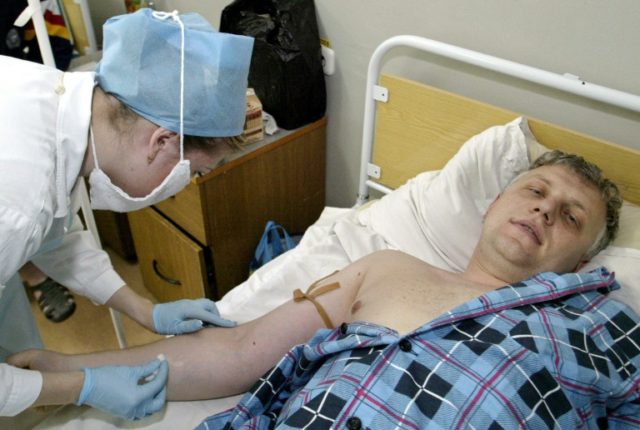 File picture shows television reporter Pavel Sheremet, in a Minsk hospital after he was fo